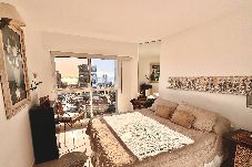 Bedroom with double bed and window with view